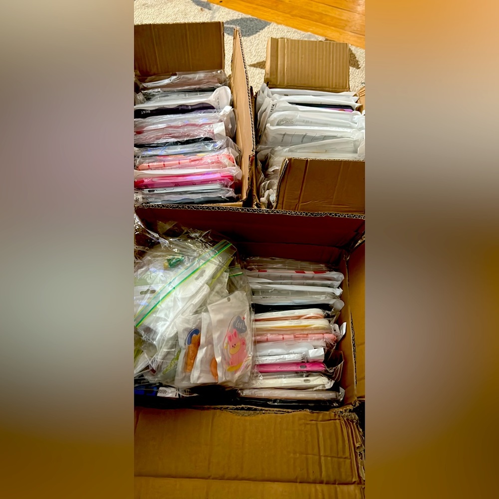 Lot of over 100 iPhone 14 cases and pop stands